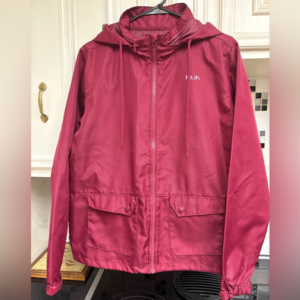Women’s Huk rain jacket. Size L